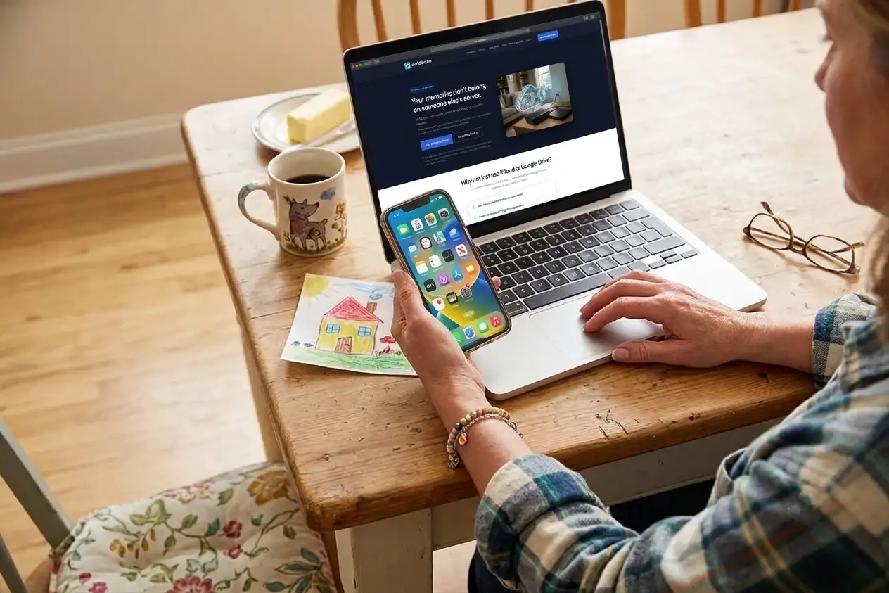 Someone browsing the myUSBdrive site on a laptop and phone at a kitchen table